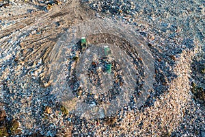 Rubbish dump. Aerial view of garbage pile in trash dump. Dump track unload waste at landfill. Biohazard for ecosystem