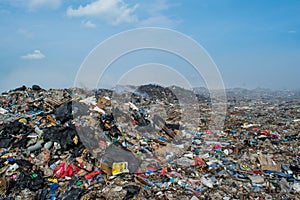 Rubbish dump zone view full of smoke, litter, plastic bottles,garbage and trash at the Thilafushi local tropical island