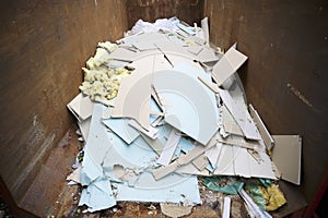 Rubbish and garbage in skip for disposal at dump site