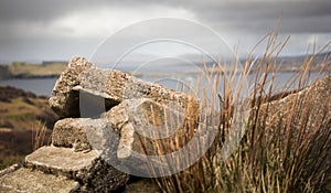 Rubble of a crumbling cottage with storm approaching