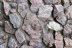 Rubble gray and brown stone wall, rubble work
