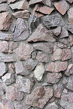 Rubble gray and brown stone wall, rubble work