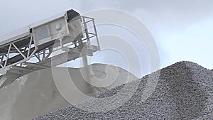 Rubble stones strew from the conveyor belt