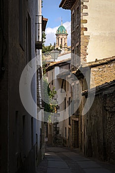 Rubielos de Mora street with the dome of the Church of the old Carmelite Convent standing out among the houses, Teruel, Spain