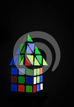 Rubik`s Cube and Triangular rubik`s Cube on black background .