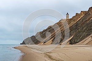 Rubjerg Knude lighthouse in Denmark seen from the beach at the North Sea