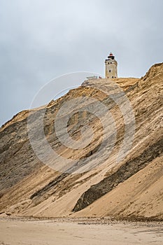 Rubjerg Knude lighthouse in Denmark seen from the beach at the North Sea