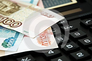 Ruble banknotes on calculator keyboard, finance, accounting, crisis and savings concept