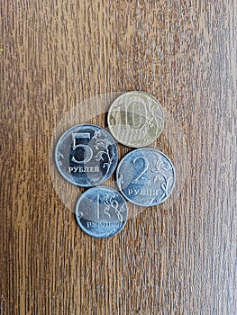 Ruble coins of different nomalals on a wooden board