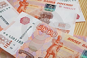 5000 rubles background. Russian banknotes at different angles.
