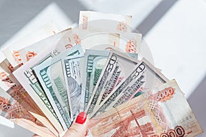 rubles lying on american dollars as a symbol of weakness russian national currency and strengthening of american dollar