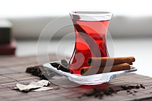 Ruby carcade tea with cinnamon sticks, cloves, badyan and bay leaves photo