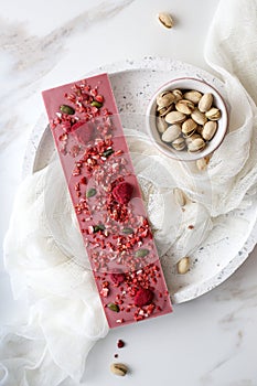 Ruby chocolate with fruits and pistachios