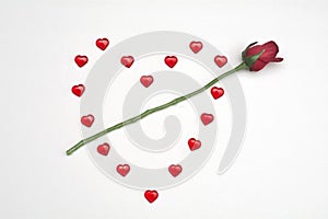 Ruby hearts on white background with rose
