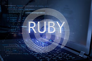 Ruby inscription against laptop and code background. Learn ruby programming language, computer courses, training