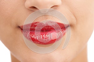 Ruby-licious. Closeup shot of a beautiful young womans mouth isolated on white.