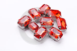 Ruby loose gemstones pile on white background