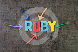 Ruby modern programming language for software development or application concept, multi color arrows pointing to the word Ruby at