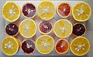 Ruby red blood oranges and navel oranges cut in half