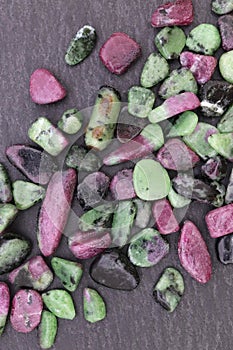 Ruby zoisite rare stones texture on black stone background