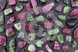 Ruby zoisite rare stones texture on black stone background