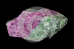 Ruby zoisite specimen, on black background.