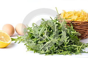 Rucola plant green leaves and pasta ingredients