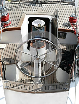 Rudder, compass and captain's hat