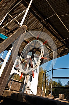 Rudder wheel of a ship on a sunny morning at protected natural swamp area of Carska bara