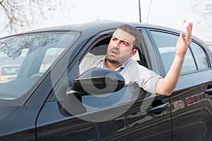 Rude man driving his car and arguing photo