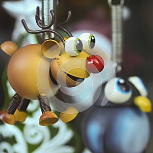 A Rudolph the Red Nosed Reindeer Ornament with a Penguin