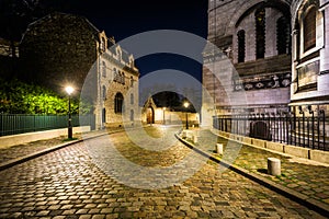 Rue du Chevalier de la Barre and SacrÃÂ©-CÃâur at night, in Paris photo