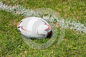 Rugby ball lying on line