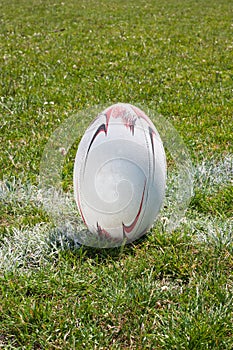 Rugby ball lying on line