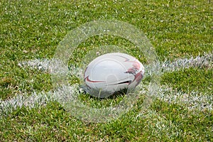 Rugby ball lying on line