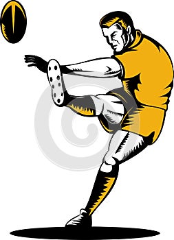 Rugby player kicking ball