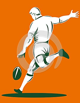 Rugby player kicking the ball