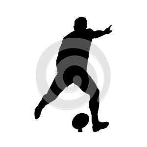 Rugby player kicking ball, vector silhouette