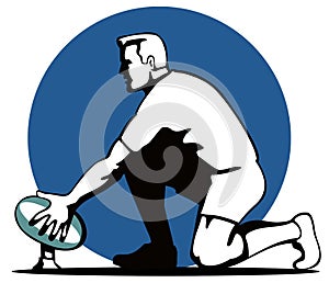 Rugby player setting up kick