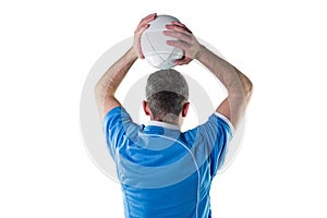 Rugby player about to throw a rugby ball