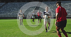 Rugby players playing rugby match in stadium 4k