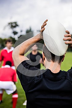 Rugby players training on pitch