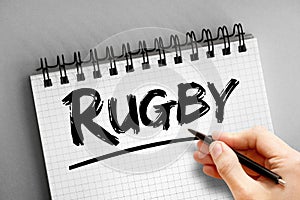 Rugby text on notepad, sport concept background