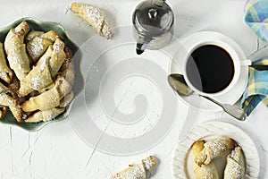 Rugelach with chocolate filling and cup of coffee.
