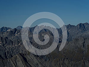 Rugged barren alpine mountain range nature landscape panorama at Brewster Hut West Coast Otago Southern Alps New Zealand