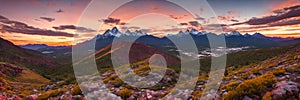 Rugged beauty of a mountain range at golden hour, with the sun setting in the background