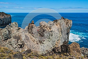 Rugged cliff with volcanic stone trail in seascape of Terceira island in Alagoa da FajÃ£zinha, Azores PORTUGAL photo