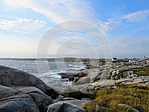 The rugged coast off of Peggys Peggys Cove Lighthouse, an active lighthouse and an iconic Canadian image, in Nova Scotia, Canada.