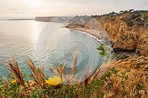 The rugged coastline at dawn, overlooking beach near Lagos in the Algarve, Portugal