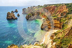 The rugged coastline overlooking Praia do Camilo, beach near Lagos in the Algarve, Portugal